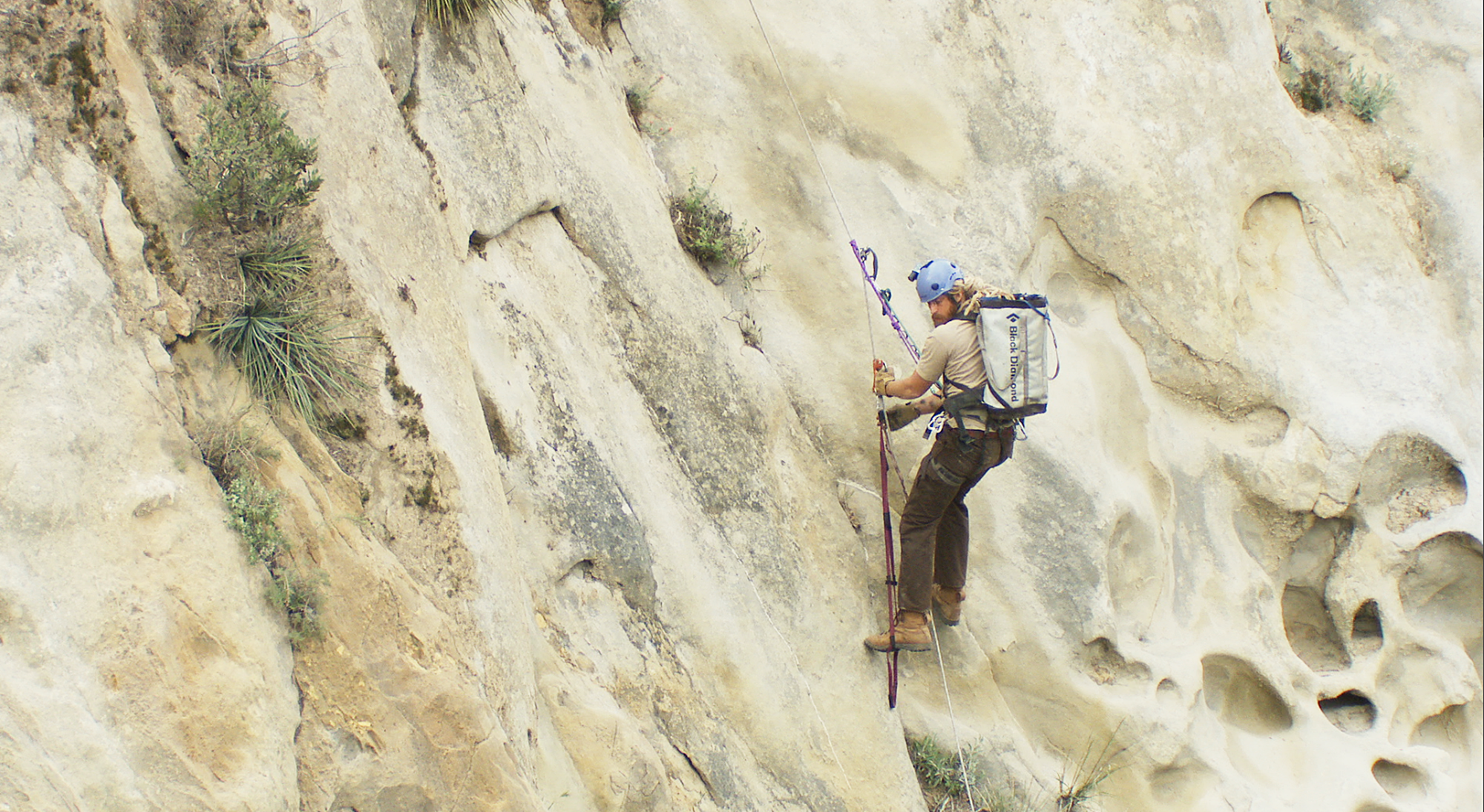 Joseph Brandt USFWS biologist climbing into a condor nest